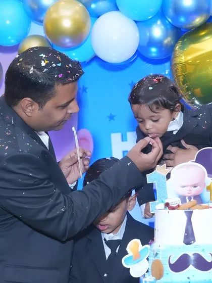 A heartwarming moment as dad feeds the birthday boy his first taste of cake at the Boss Baby themed party. These are the candid memories I help create and capture.