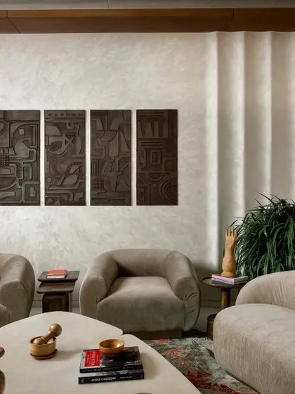 For this Jaipur home, I created a set of four deeply textured wooden art panels. This kind of sculptural wall art adds a modern and sophisticated touch, playing with light and shadow to create a dramatic effect.