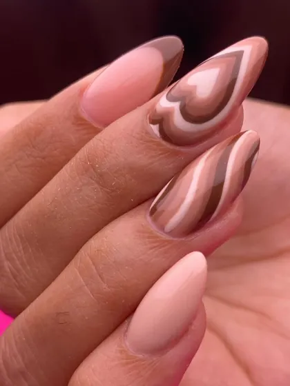 A trendy and sweet design inspired by latte art. This set features a mix of brown and nude polishes swirled into heart shapes and abstract patterns.