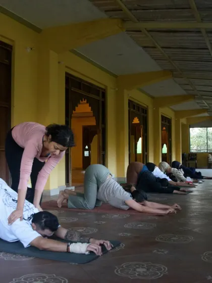 Guiding students through a gentle stretch during our Dehradun retreat. Creating a tranquil space for growth and connection is at the heart of my teaching.