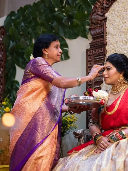 A mother gives her blessings to the bride during a traditional ceremony, a moment rich with emotion and cultural significance.