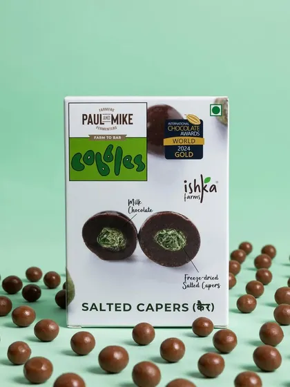 A creative shot of Salted Capers chocolate balls, arranged in a neat pattern to create a visually interesting product photo.