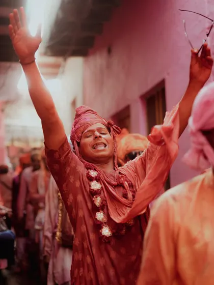 A comprehensive photo series from Lathmaar Holi in Barsana. These images document the unique tradition where women playfully hit men with sticks, recreating a legend of Lord Krishna and Radha. The photos are filled with motion, color, and raw emotion.
