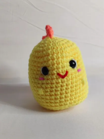 A sunny yellow dino keychain.