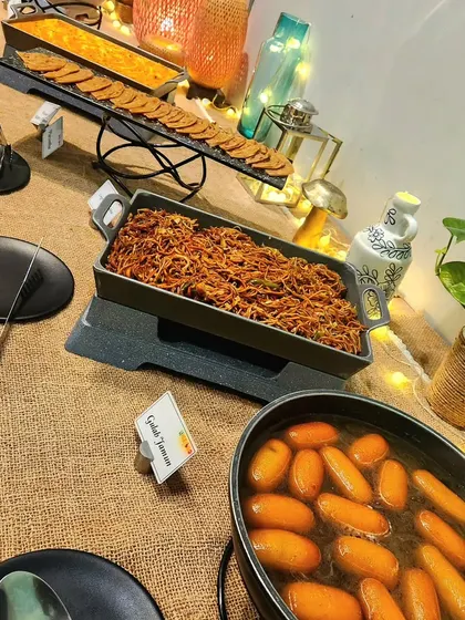 The dessert section of our buffet, featuring sweet gulab jamun and other treats. Every meal should end on a sweet note.
