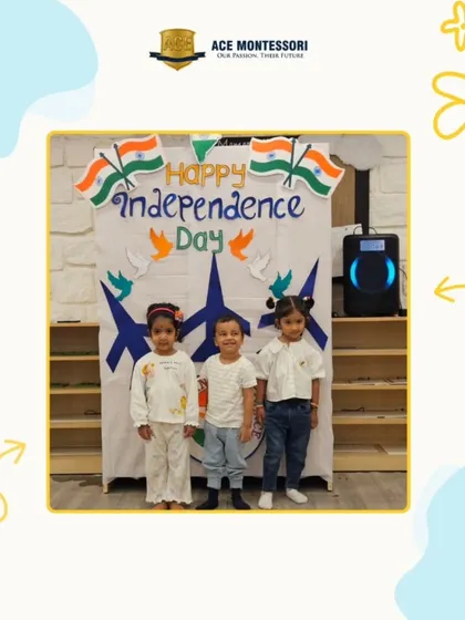 Three children stand proudly in front of our Independence Day backdrop. Dressing in tricolor outfits and participating in the celebration helps instill a sense of national pride.