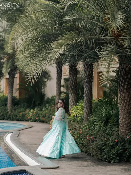 A beautiful shot of a guest in a stunning outfit, walking by the pool. We capture the style and elegance of your guests as well.