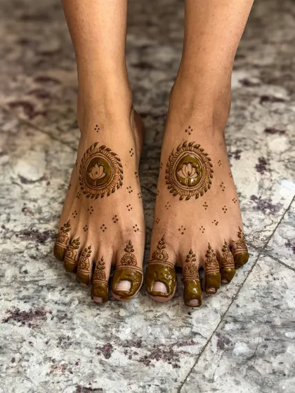 A minimalistic leg design featuring a lotus mandala, perfect for brides or guests who prefer understated elegance.