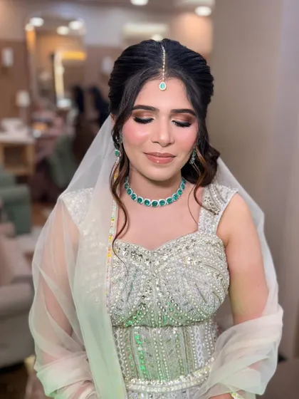 Eyes closed to show the soft, shimmery eyeshadow. The blend is seamless, creating a beautiful and polished look.