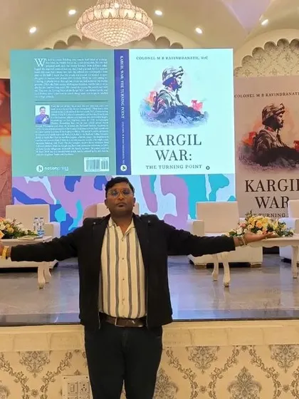 Posing on the professionally set stage for the Kargil War book launch.