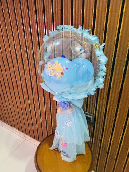 A beautiful custom balloon bouquet, perfect as a gift or decor for a 'Welcome Baby' celebration.