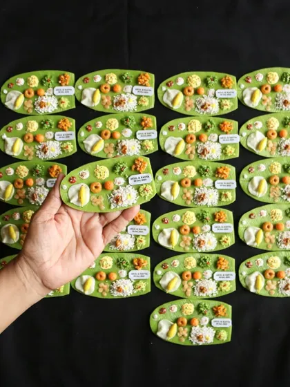 A large batch of personalized South Indian meal magnets, ready to be shipped out for a wedding celebration.