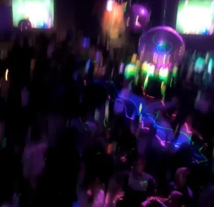 A motion-blur shot capturing the wild energy of the Tredence corporate party.