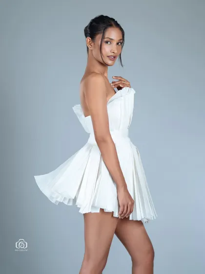 A side view of the paper dress, highlighting its interesting silhouette. This shot is a great example of my creative and conceptual studio work.