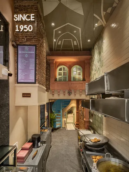 For this 75-year-old restaurant in Old Delhi, I created a double-height space that blends traditional aesthetics with modern functionality. The design features a prominent jharokha and exposed brick, paying homage to the area's heritage while revitalizing the brand's identity.
