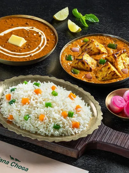 A classic vegetarian combo of Dal Makhani, Paneer Tikka Masala, and vegetable rice.