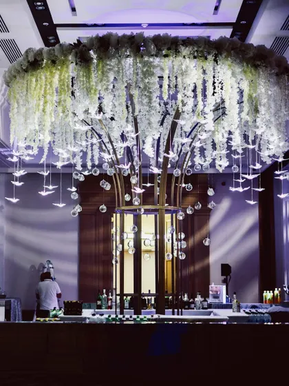 The full view of the magnificent 'tree of life' ceiling installation over the bar. This was the centerpiece of the Sangeet decor, creating a breathtaking focal point.