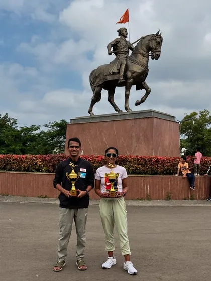 Posing with our trophies in front of the iconic Shivaji Maharaj statue. A proud moment of victory for our team.