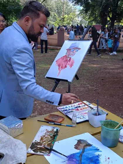 Me in action during the portrait demonstration in Satara. I'm using my watercolour palette to mix the right skin tones.