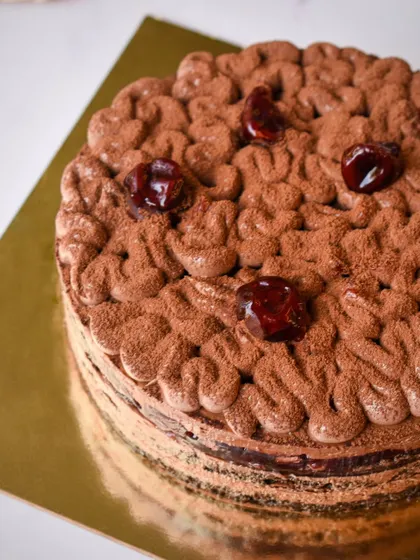 Our Cherry & Chocolate cake, perfect for sharing with a loved one. The combination of rich chocolate and tart cherries is a classic for a reason.