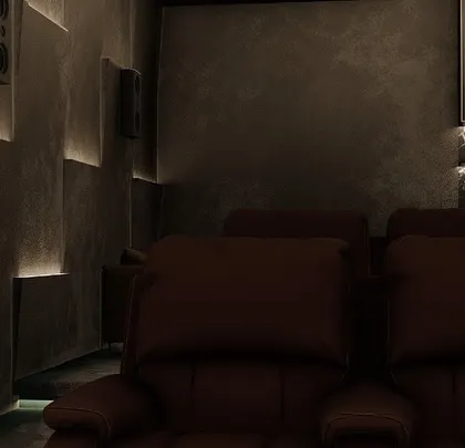 The warm glow from the backlit wall panels creates a cozy and inviting atmosphere in this modern theater.