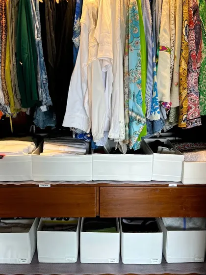 Here's another example of using fabric bins on shelves to create a drawer-like system. This method is perfect for Indian wardrobes and helps keep folded clothes neat and accessible.