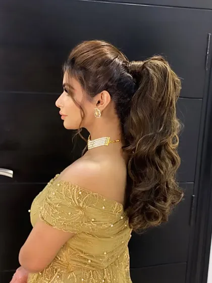 My client making heads turn with this powerful, high-volume ponytail. It's a confident and glamorous style that commands attention.
