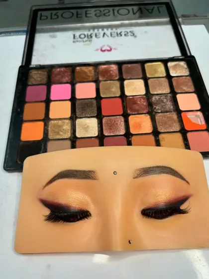 The completed smokey eye look on our practice board. We focus on achieving a smooth gradient from light to dark for that perfect sultry effect.