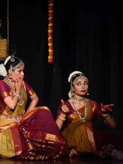 The expressive faces in this shot capture the drama and emotion of the 'Radha Krishna' story. Duet choreography allows for this kind of rich, interactive storytelling.