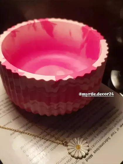A close-up showing the inside of the pink marbled jar. The smooth, polished interior contrasts beautifully with the textured exterior.