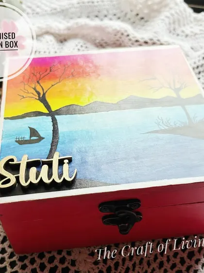 A beautiful hand-painted wooden box with a serene landscape design, personalized with the name "Stuti." Each box is a unique piece of art.