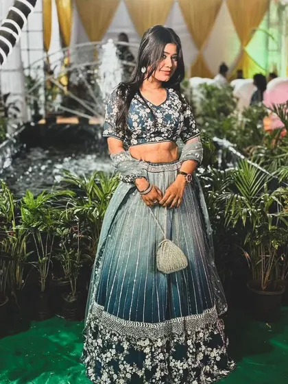 A full-length shot of our client in the stunning blue ombre lehenga. The way the color transitions from dark to light is simply beautiful.