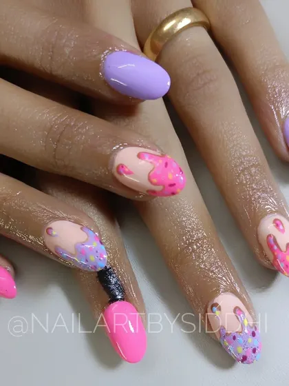 A fun and playful set of nails inspired by melting ice cream. I used bright pastel colors and 3D sprinkle details to create a whimsical look, with one nail even designed to look like a tiny nail polish bottle.