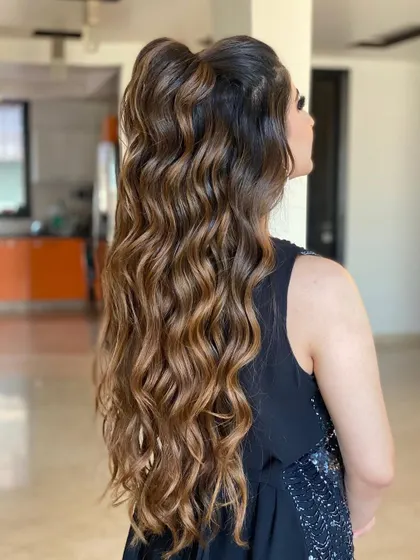 This half-tie wavy look is one of my favorites to teach. It perfectly showcases how extensions can be used to create a high-impact style that looks both effortless and put-together.