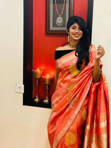 The full look of the block-printed orange Kanjeevaram, styled for a modern festive look.