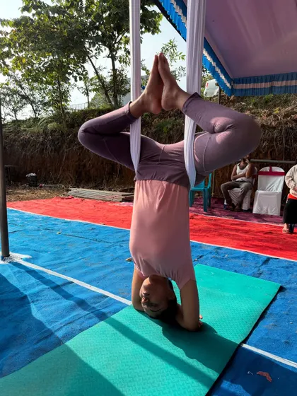A beautiful expression of an inverted pose. The aerial silk allows for creativity and freedom of movement, making each practice unique.