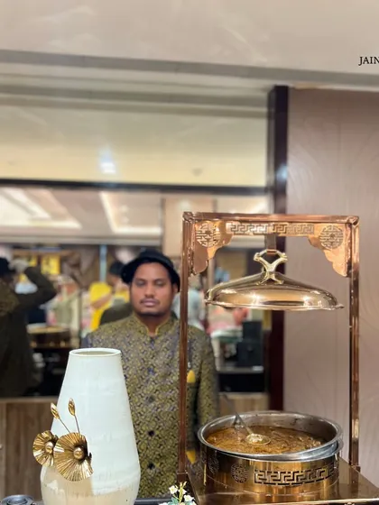 The perfect blend of flavour and presentation awaits. A member of our traditionally dressed service team, adding a touch of heritage to the event.