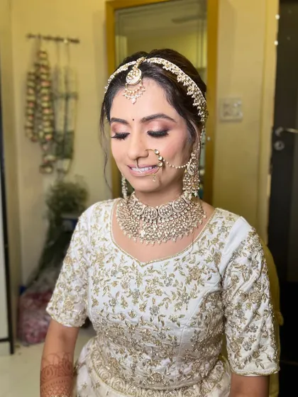 A serene portrait with eyes closed, highlighting the soft, blended eyeshadow.