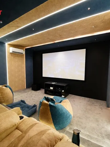 Another view of the flexible seating, showing how the bean bags and a pet bed are placed in front of the main seating, creating a relaxed and informal atmosphere.