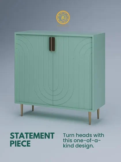 This mint green console is a true statement piece. The arched, embossed pattern on the doors and delicate legs create a one-of-a-kind design that is sure to turn heads.