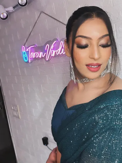 A closer look at this stunning cocktail glam. The smokey eye is blended to perfection, and the skin is luminous, catching the light beautifully.