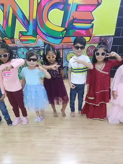 Ready to perform! The kids are backstage in their "Kala Chashma" sunglasses, feeling cool and confident before their big moment.