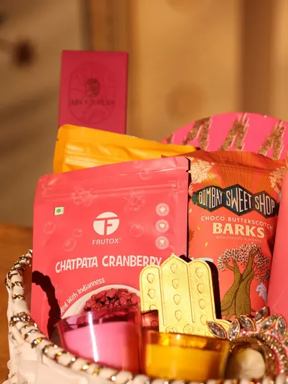 Another detail shot of the Diwali hamper, focusing on the gourmet treats from Frutox and Bombay Sweet Shop.