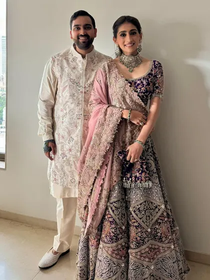 A full-length view of this gorgeous guest look. The makeup is polished and refined, perfect for such a grand event.