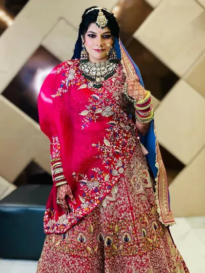 A full-length view of the bride, showing how the makeup and styling come together to create a stunning overall presence.