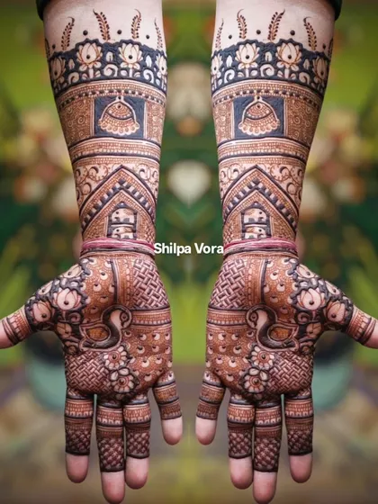 A full-arm design for a wedding guest or family member, featuring peacocks and kalash motifs. This was a team effort for a large booking.