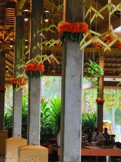 Decorating the venue's pillars with marigolds and woven palm leaves. This is a simple but effective way to carry the traditional theme throughout the entire space.
