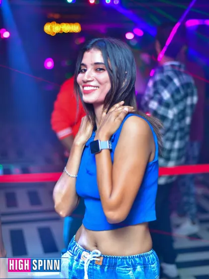 A guest enjoying the music at Drava's Lipstick Ladies Night. The vibe is always fun and energetic.