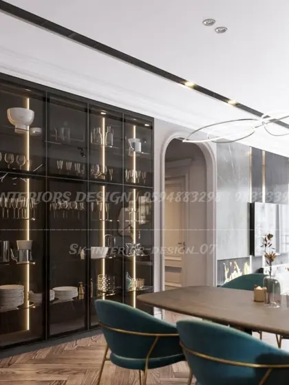 For clients with extensive collections, I design floor-to-ceiling crockery units like this one. The dark frame, clear glass, and vertical strip lighting turn everyday items into a beautiful display.