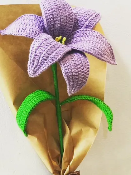 I love working with different colors, and this purple lily is a great example. The rich color and detailed stitching make it a striking piece that stands out in any bouquet or as a single stem.